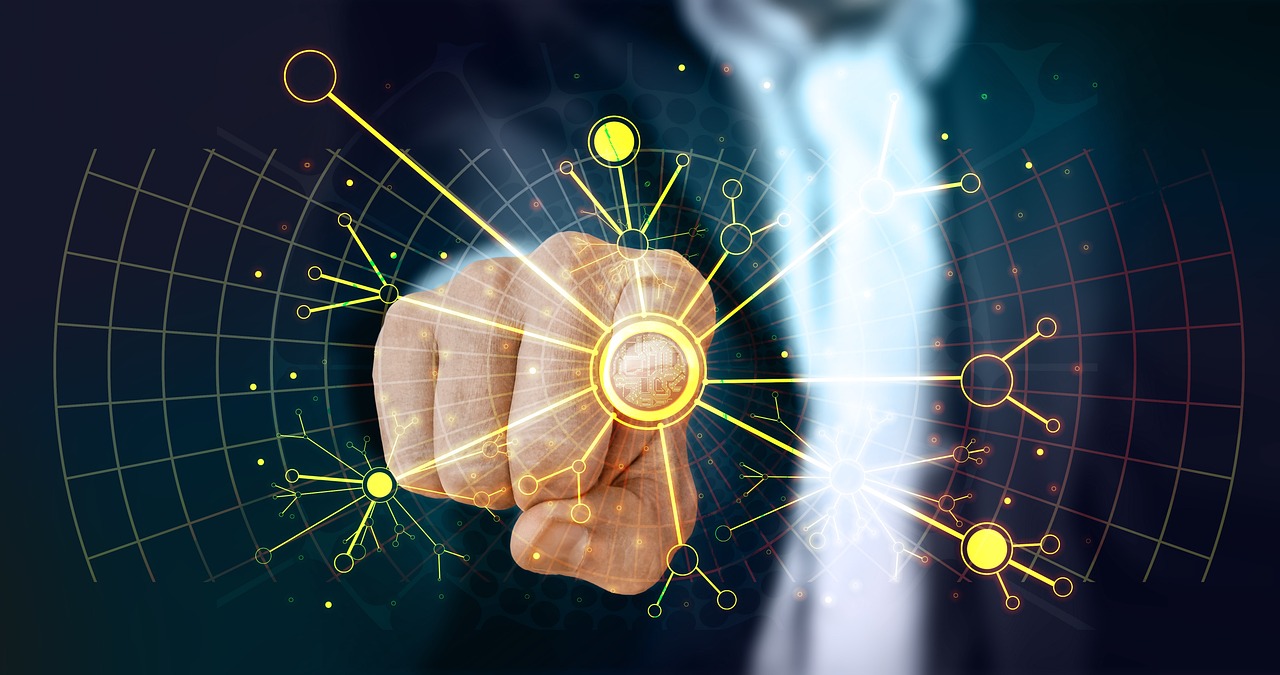 web-3963945_1280 (1) Closeup of a business man's finger pointing at screen viewer with yellow graphics on a supposed screen